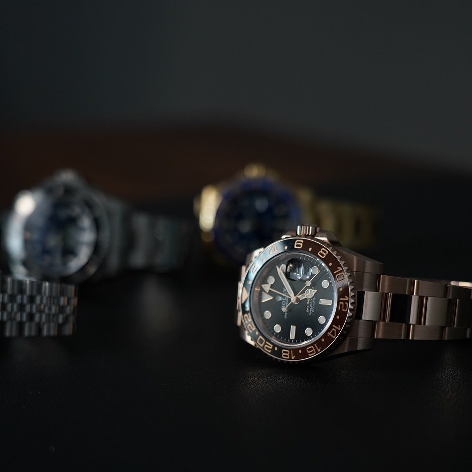 Premium watch giveaway display showing mens Swiss automatic timepieces